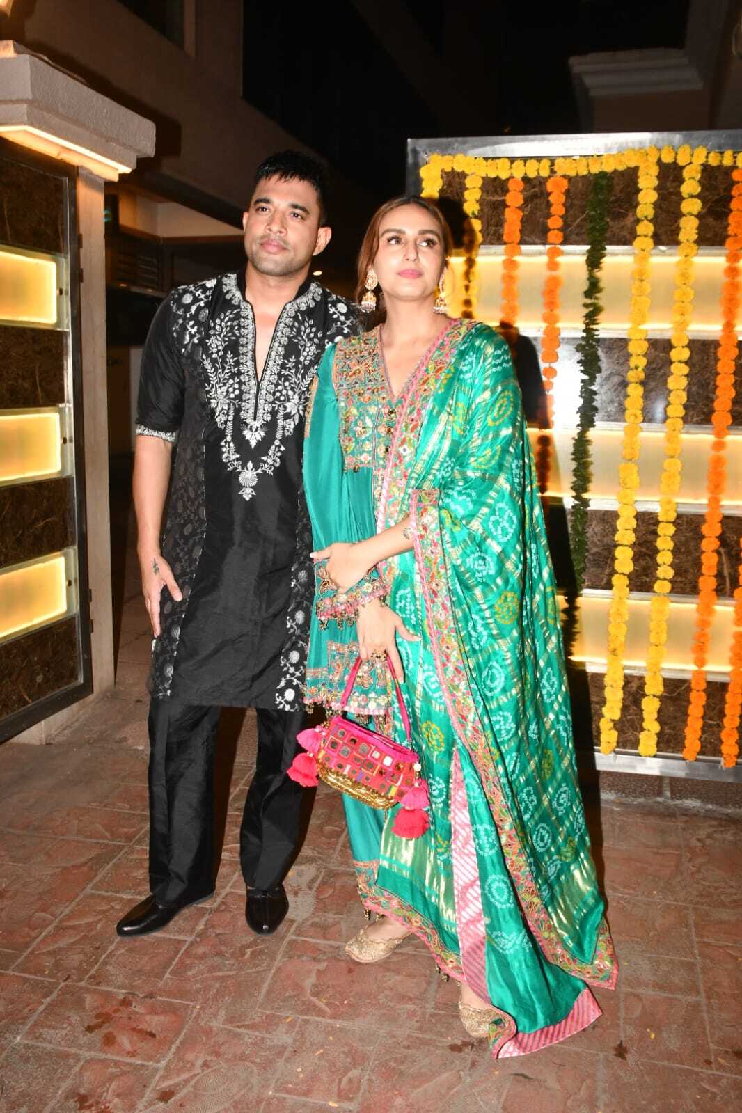 Huma Qureshi made yet another dazzling appearance with beau Rachit Singh at Ektaa Kapoor's bash. She looked stunning in a green-coloured suit set which she paired with statement jewellery. While, Rachit complimented her in shimmery black outfit.